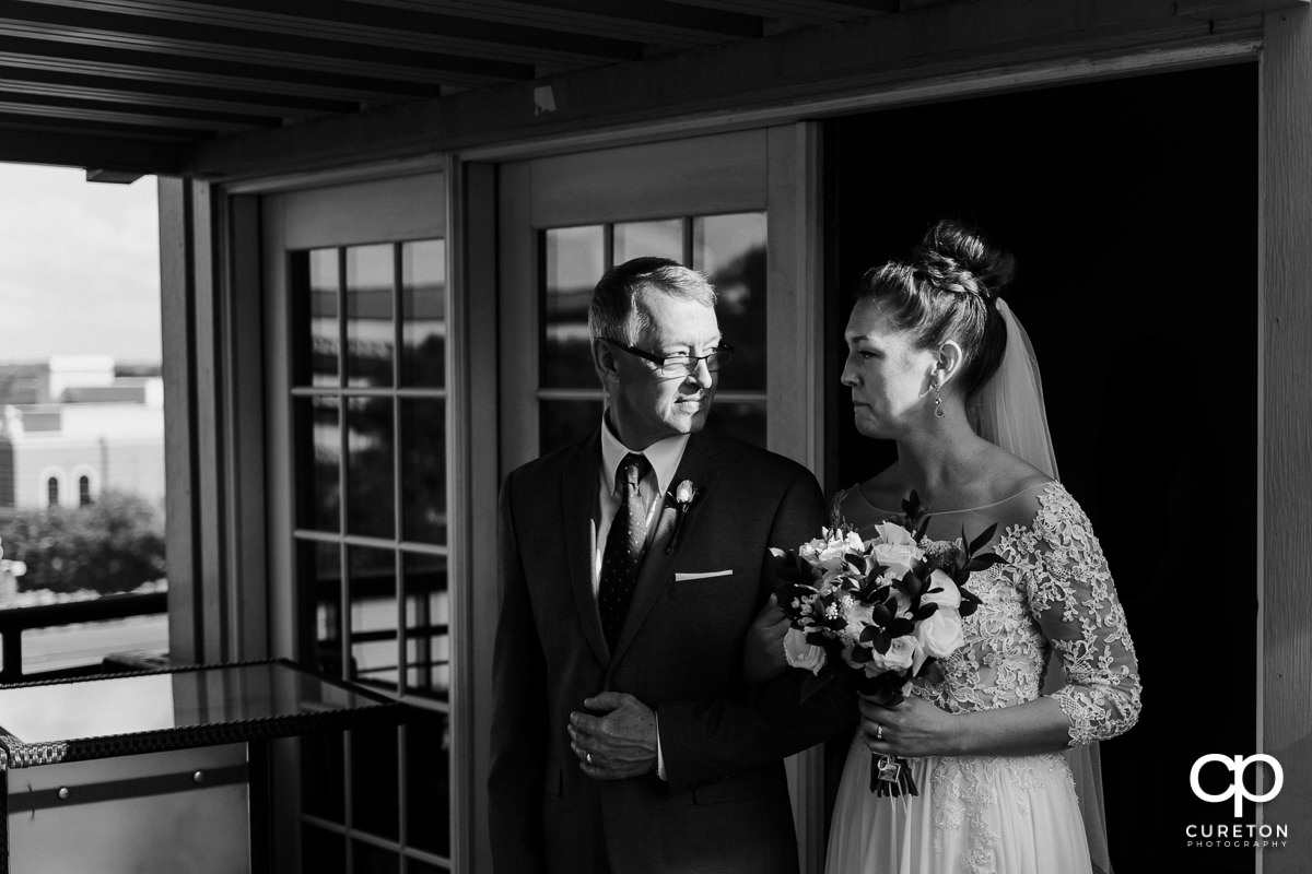 Bride and her dad walking down the aisle.