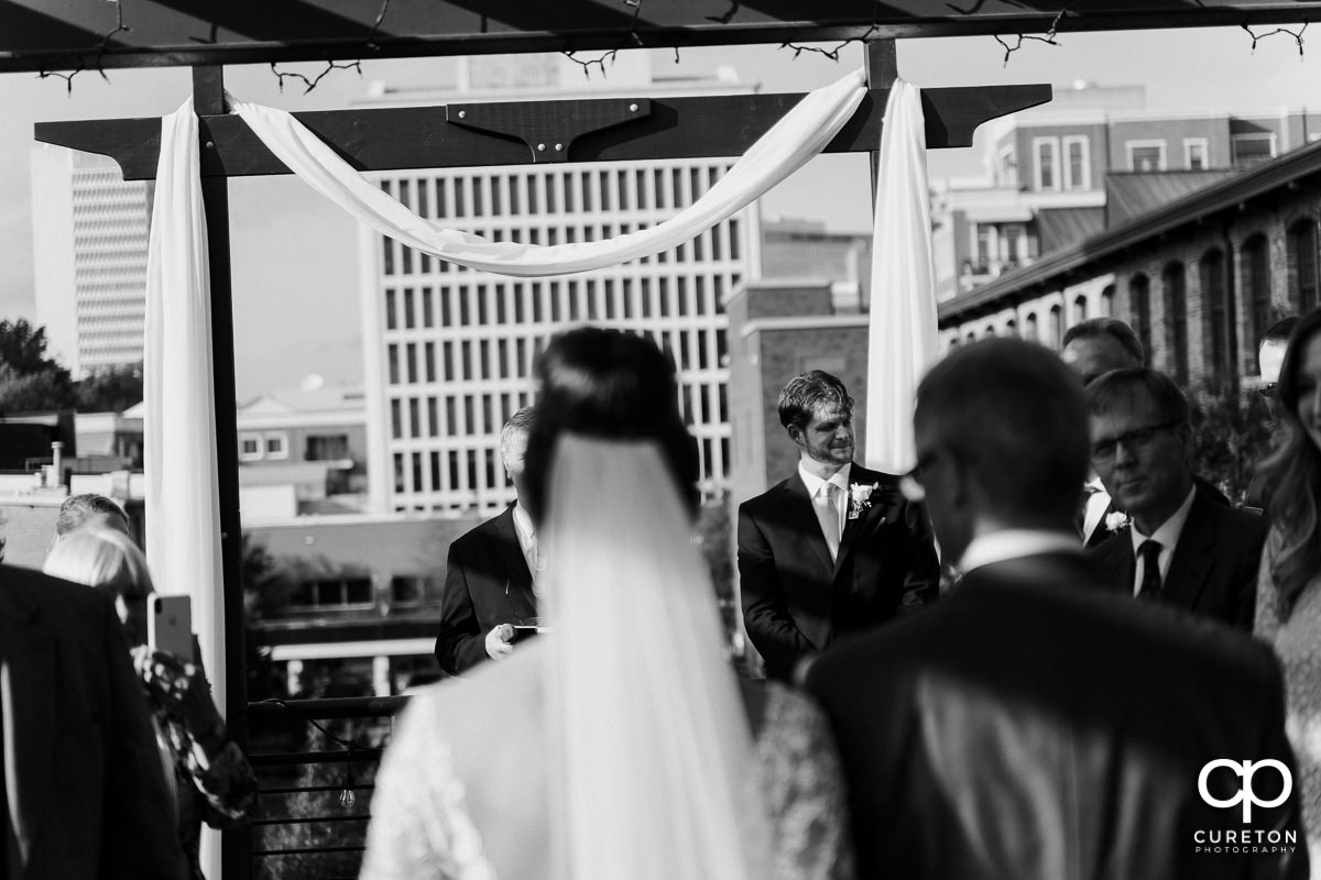 Groom getting emotional as he sees his bride walking down the aisle at their Loft at Soby's wedding in downtown Greenville,SC.