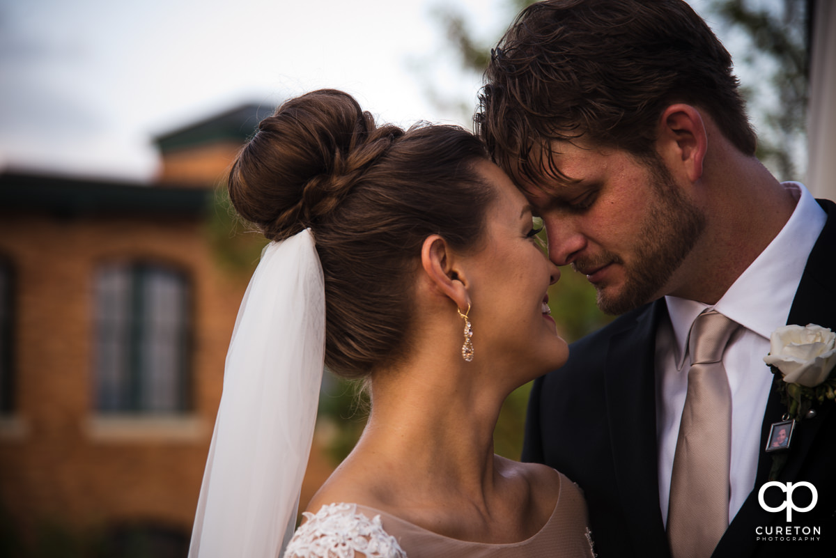 Bride and groom getting close after their Loft at Soby's wedding in downtown Greenville,SC.