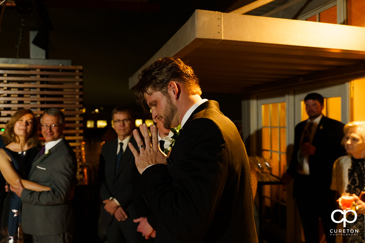 Groom at his reception.