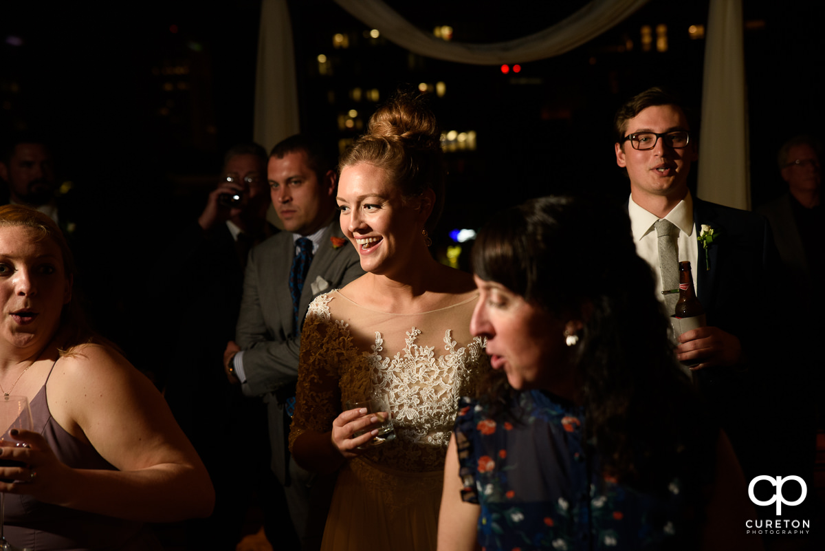 Guests dancing at the wedding reception on the rooftop at Soby's Loft in Greenville,SC.