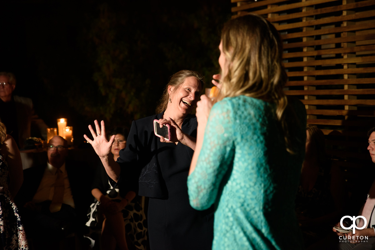 Guests dancing at the wedding reception on the rooftop at Soby's Loft in Greenville,SC.