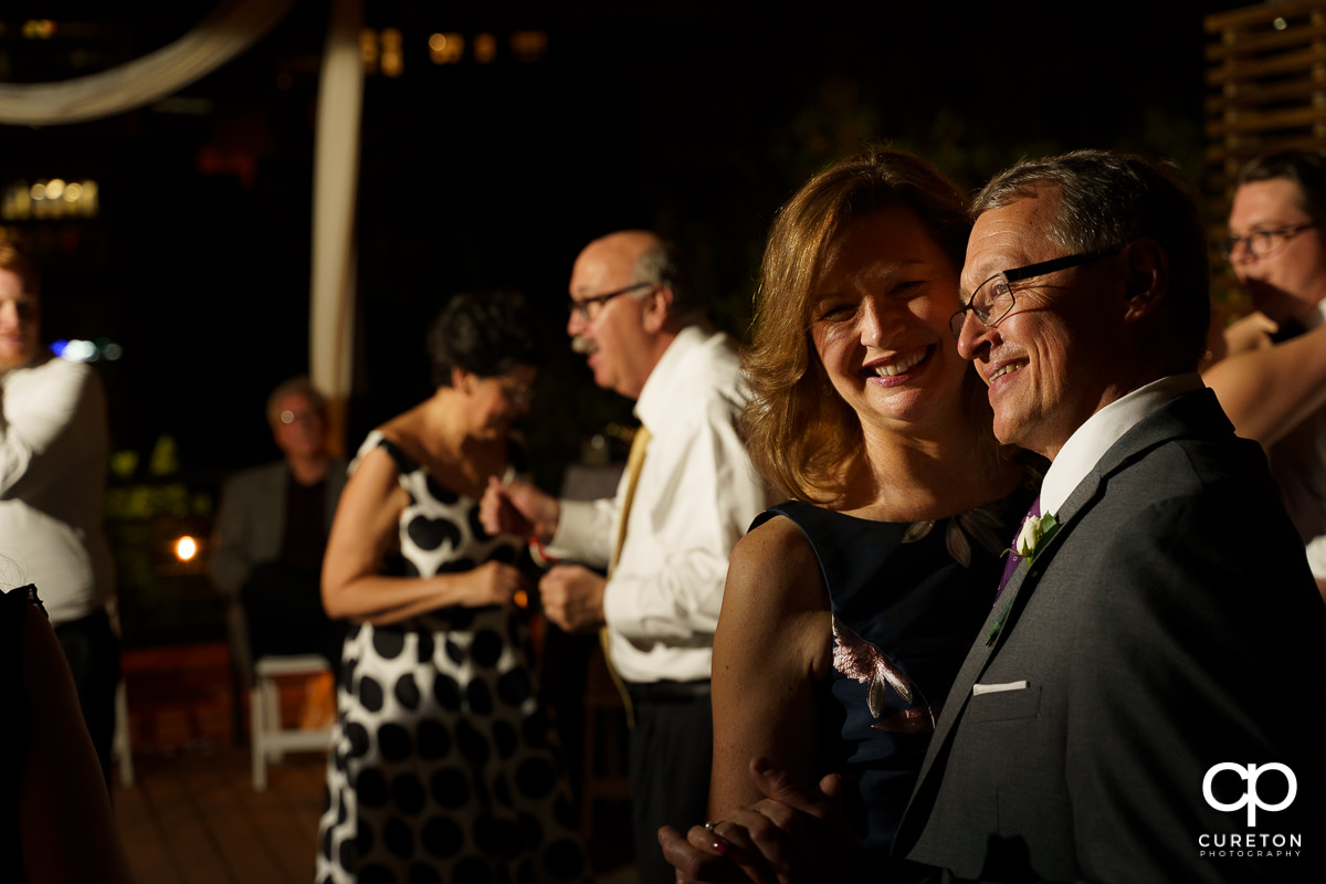 Guests dancing at the wedding reception on the rooftop at Soby's Loft in Greenville,SC.