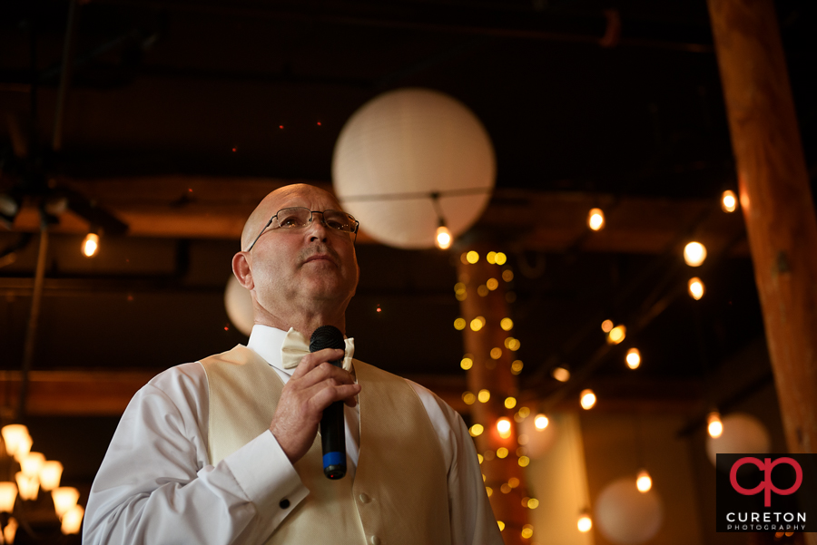 Bride's father telling a story.