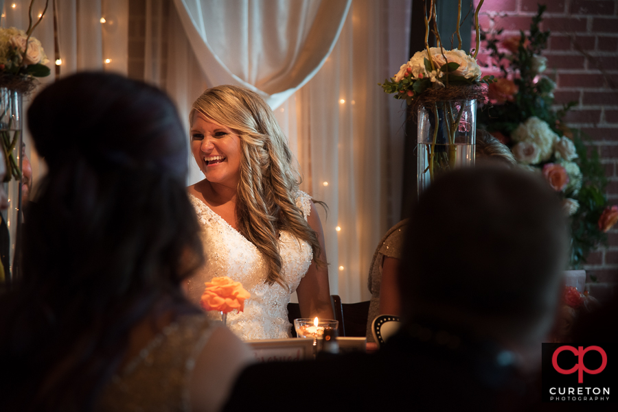 Bride laughing.