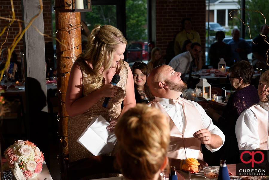 Bridesmaid giving a toast.