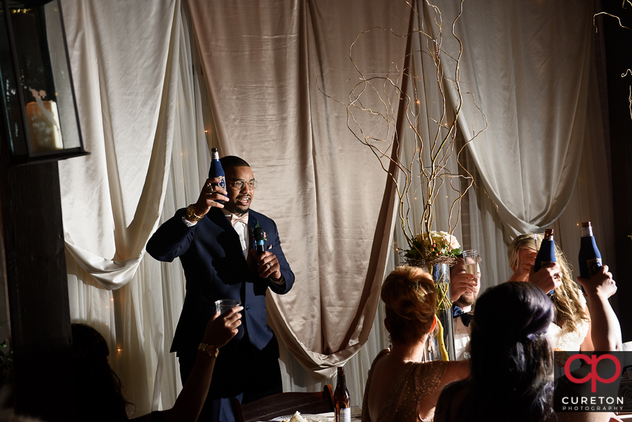 Groomsmen giving a toast.