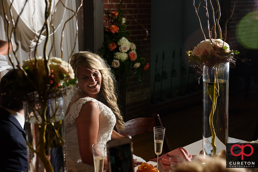 Bride's sisters sing a song for the bride.