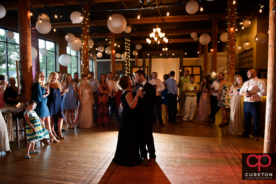 Groom dancing with his mom.