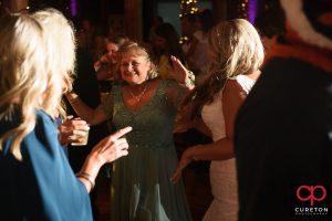 Bride's mom dancing.