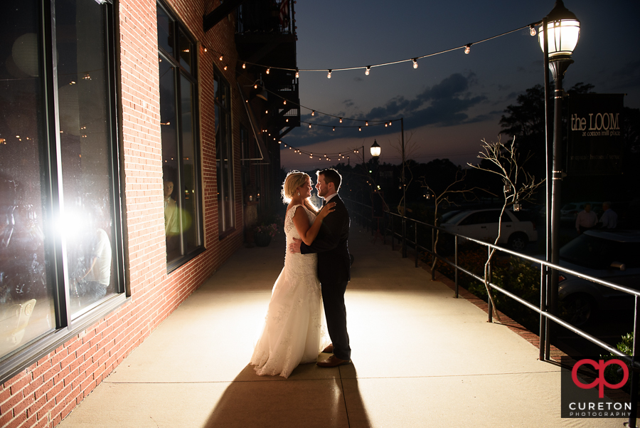 Bride and Groom outside the Loom at sunset.