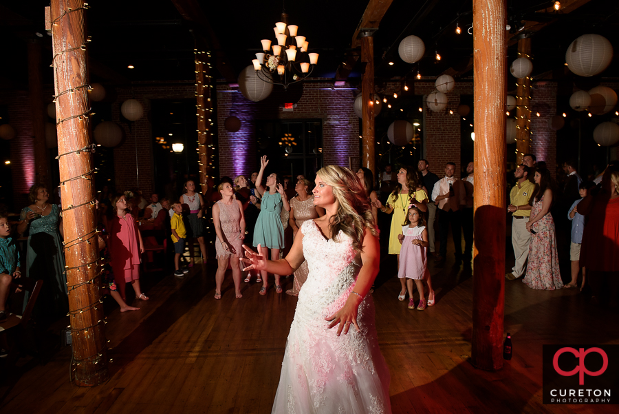 Bride tossing the bouquet.