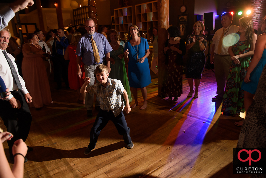 Wedding guests dancing to the sounds of Greenville wedding dj Uptown Entertainment.