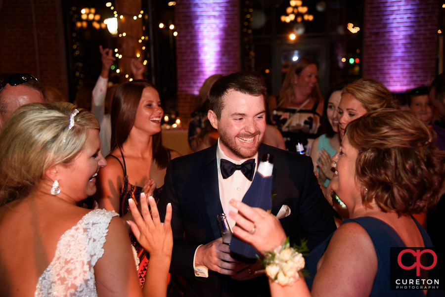 Groom laughing.