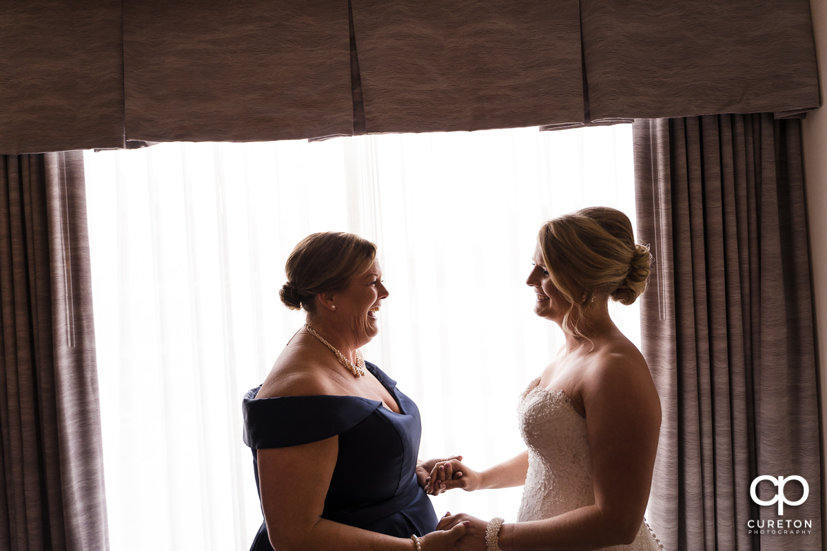 Bride sharing a moment with her mom before the ceremony.