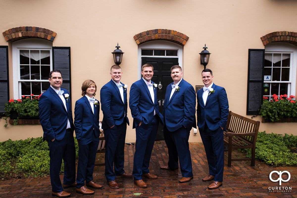 Groom and groomsmen in front of the house before their Mary's at Falls Cottage wedding in downtown Greenville,SC.