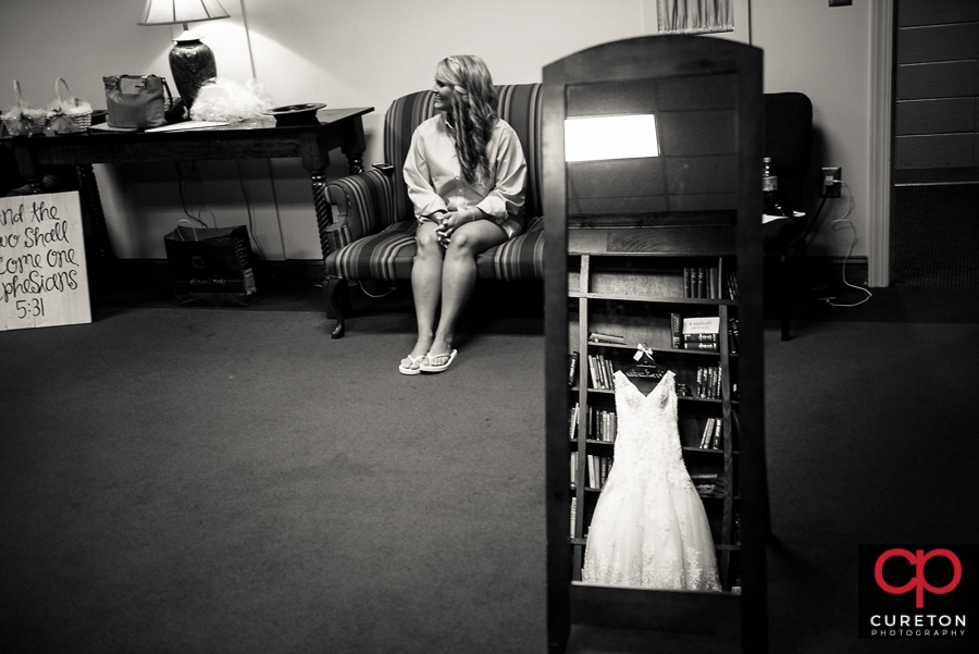 Bride and her dress in the mirror.