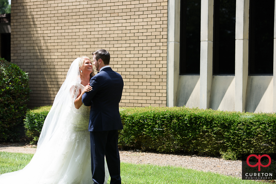 Bride and Groom first look at Mitchell Road Presbyterian Church.