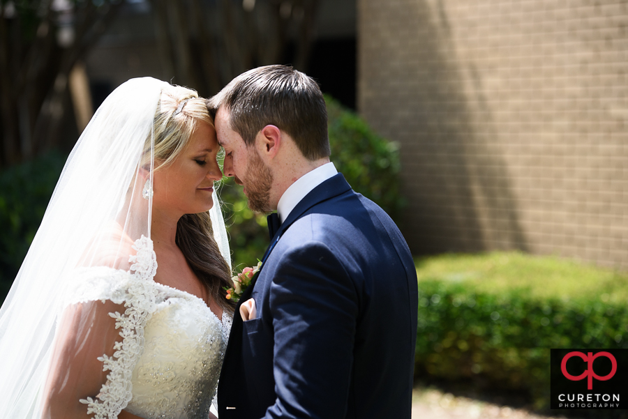 Bride and Groom first look at Mitchell Road Presbyterian Church.