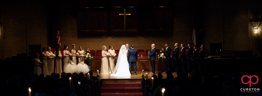 Wedding party at the alter.