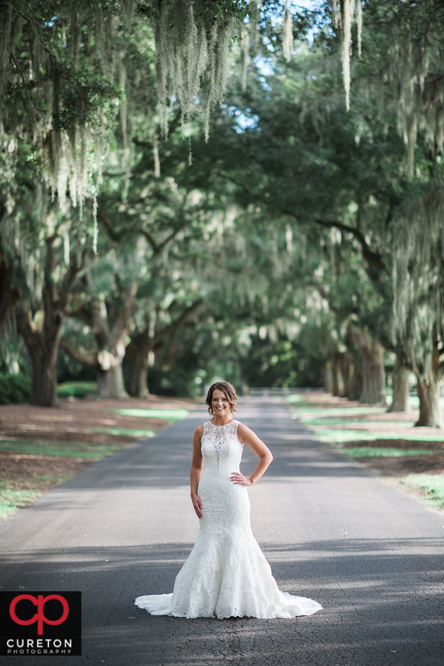 Pretty bride standing under Spanish moss during a South Carolina coast bridal session.