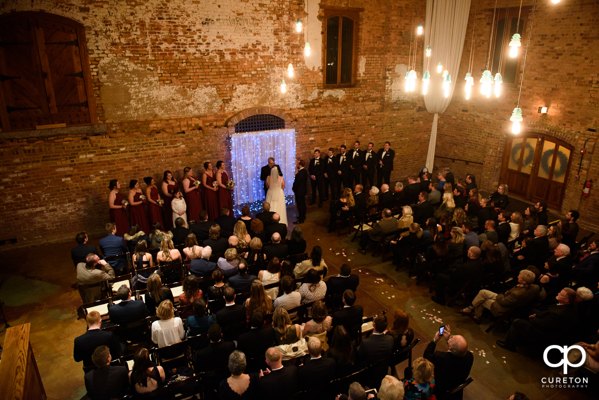 Panoramic shot of a wedding ceremony at the old cigar warehouse in downtown Greenville South Carolina.