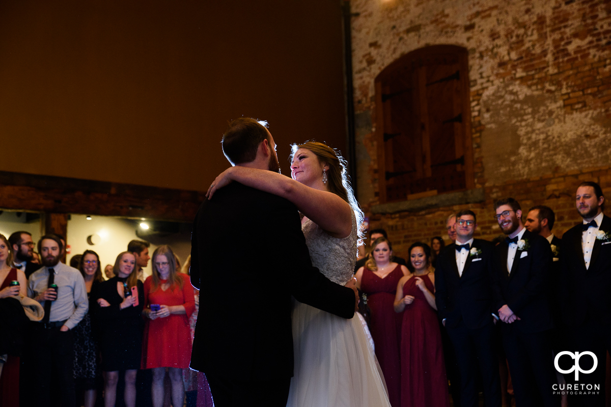 Bride and groom first dance at the old cigar warehouse in downtown Greenville.
