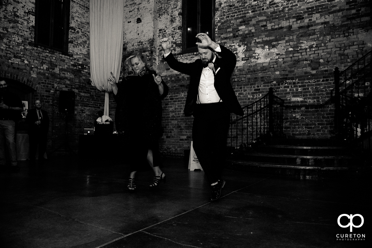Groom and his mom performing a cool dance at the reception.
