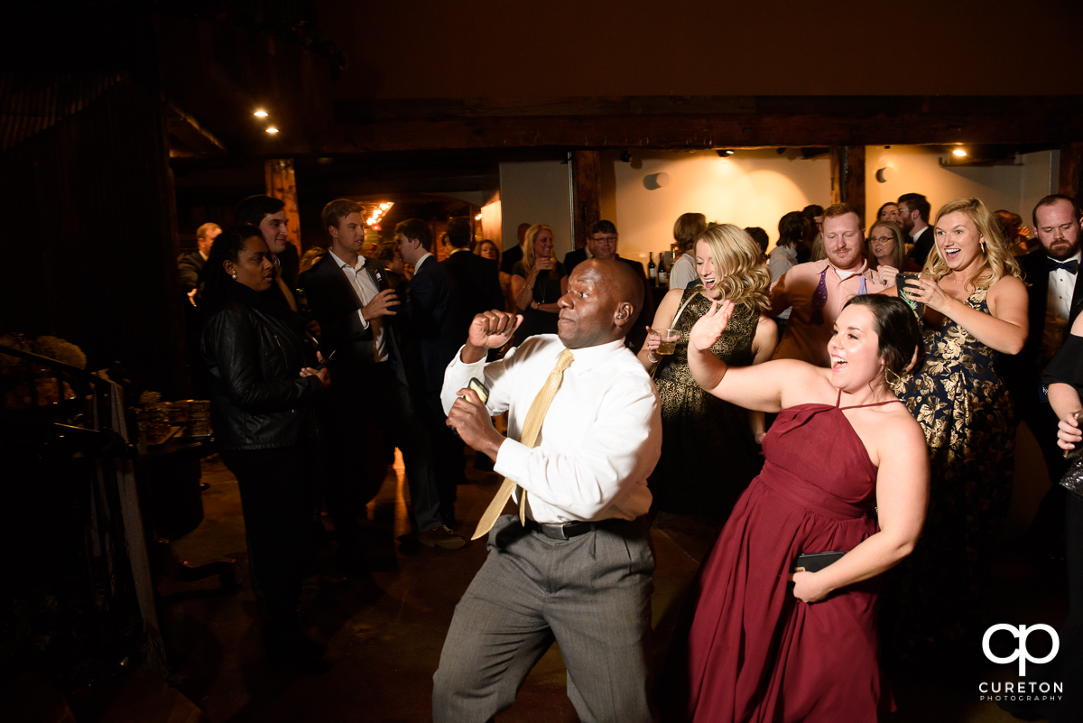 Wedding guests dancing at The Old Cigar Warehouse.