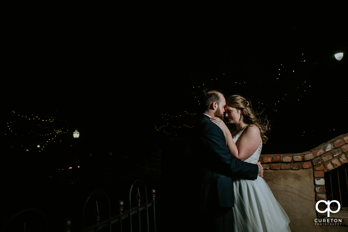 Bride and groom outside after dark at the Old Cigar Warehouse.