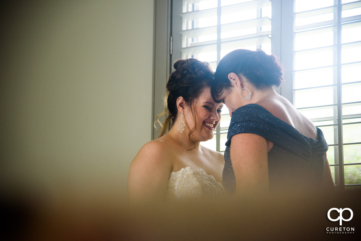 Bride and her mom hanging out before the ceremony.