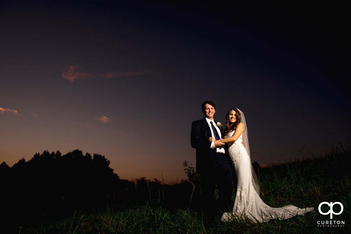 Bride and groom at sunset after their wedding at Noah's Event Venue in Greenville,SC..