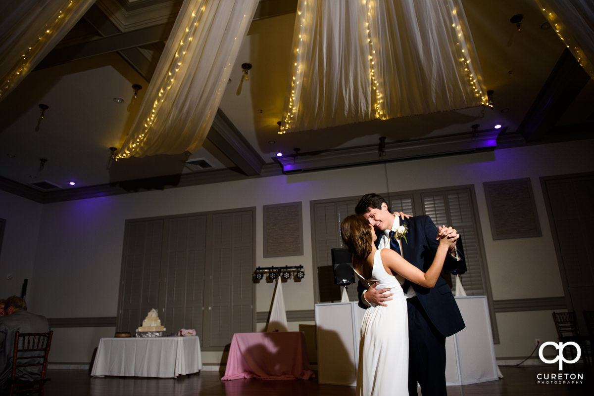 Bride and groom sharing a first dance at their wedding reception at Noah's Event Venue in Greenville.SC.