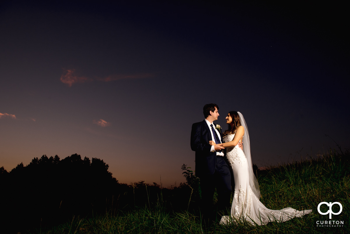 Bride and groom at sunset at their Noah's event venue wedding in Greenville,SC.