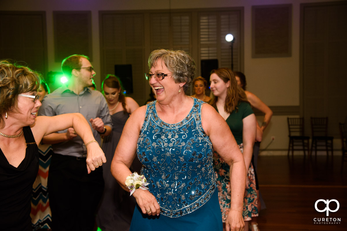 Groom's mother dancing at the reception.