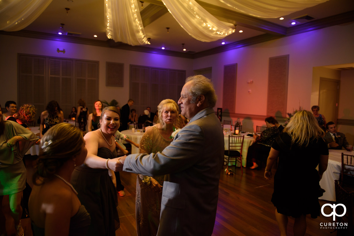 Wedding guests dancing at the reception at Noah's Event Venue in Greenville,SC.