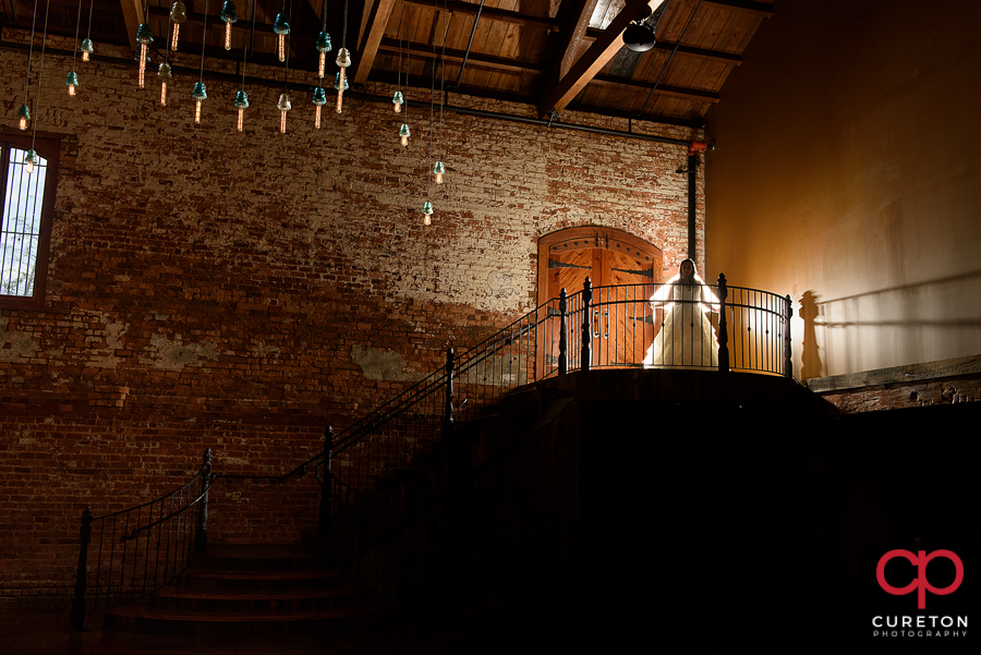 Jessica on the top of the stairs during her Old Cigar Warehouse bridal session.