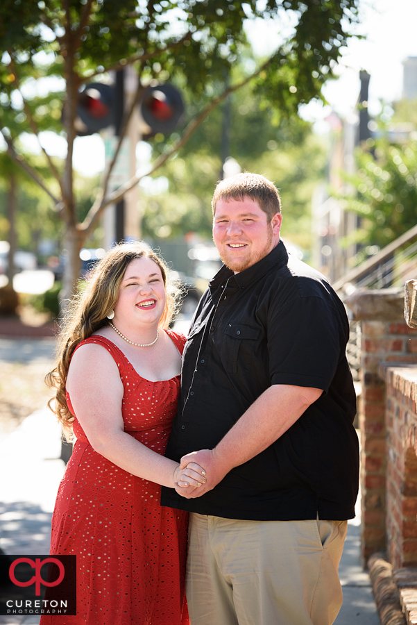 Engaged couple downtown on a summer day.