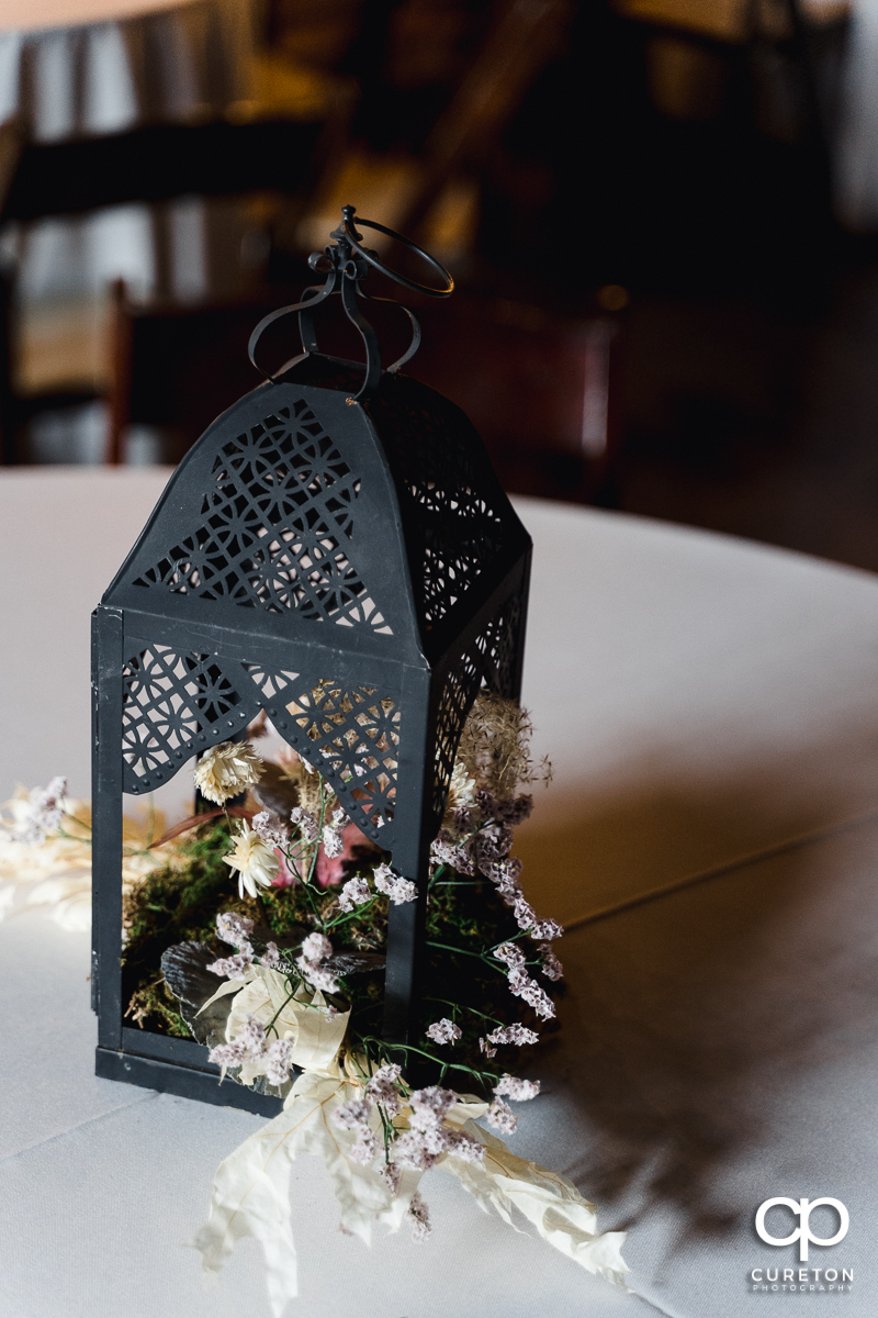 Table centerpieces by Frilly Bloomers.