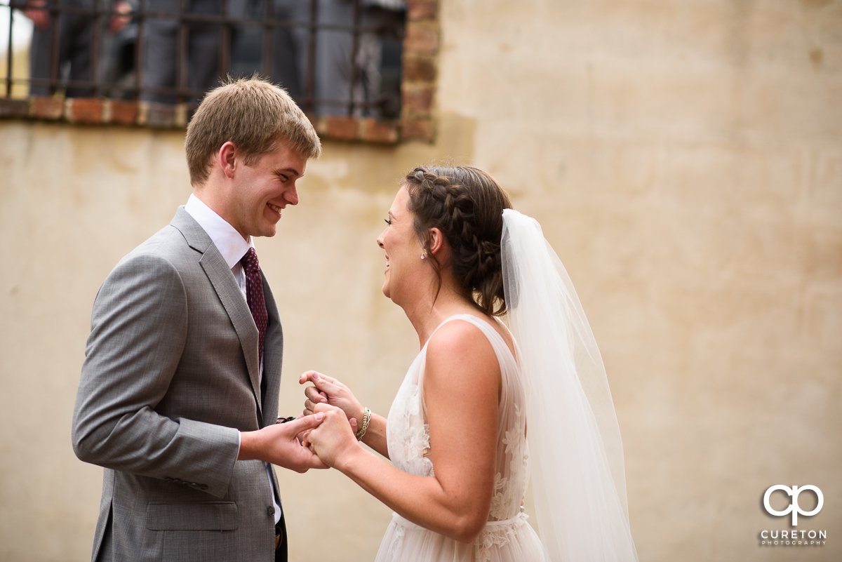 Bride and groom sharing a moment at a pre wedding first look at The Old Cigar Warehouse.