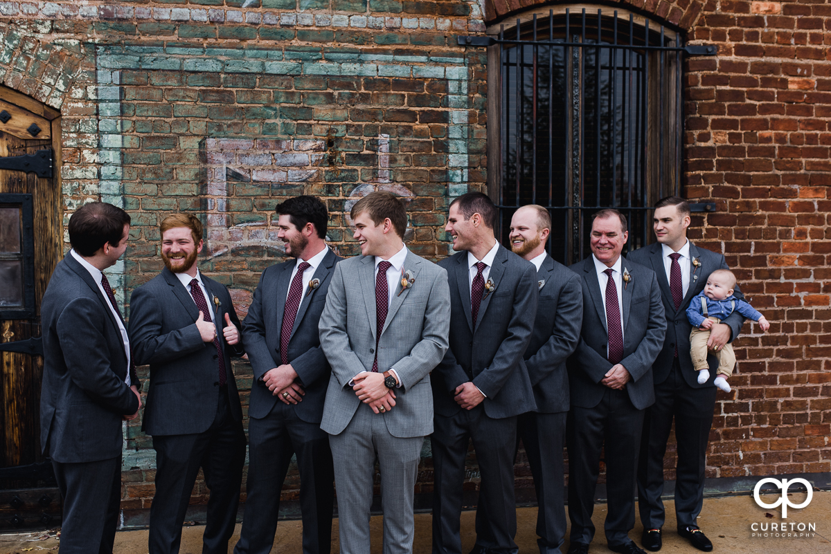 Groom and groomsmen hanging out before the ceremony.