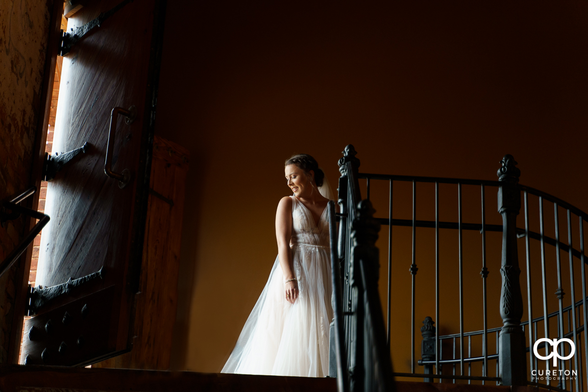 Bride making her grand entrance at the wedding ceremony at The Old Cigar Warehouse.