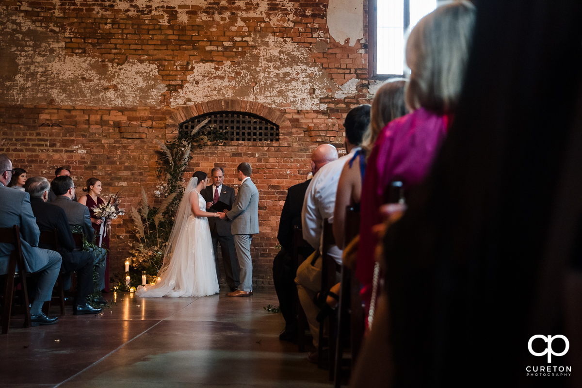 Bride and groom saying their vows.