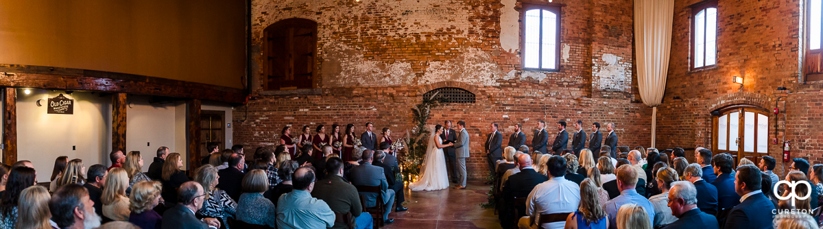 Panorama of a wedding ceremony at The Old Cigar Warehouse.