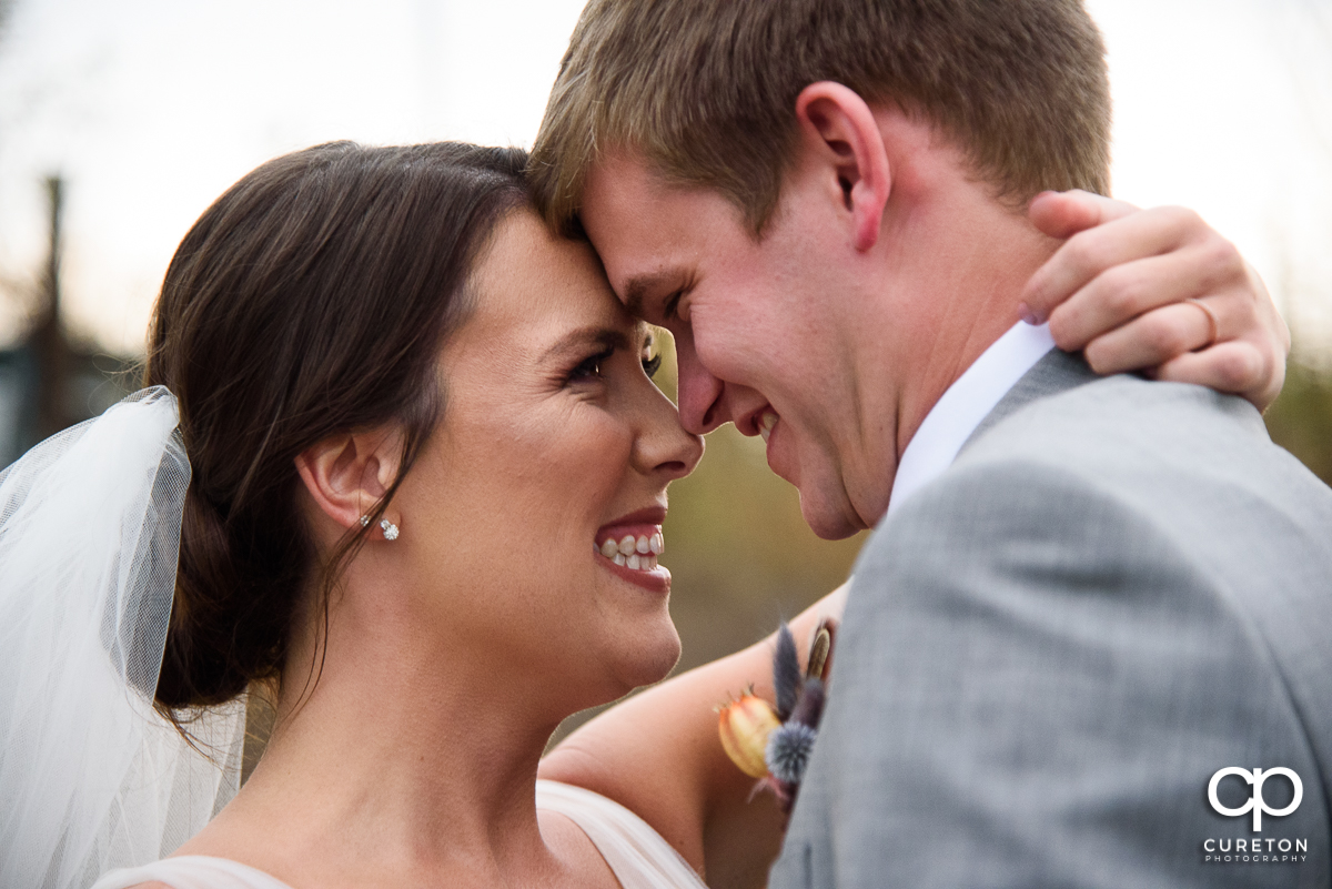 Newlyweds snuggling after the ceremony.