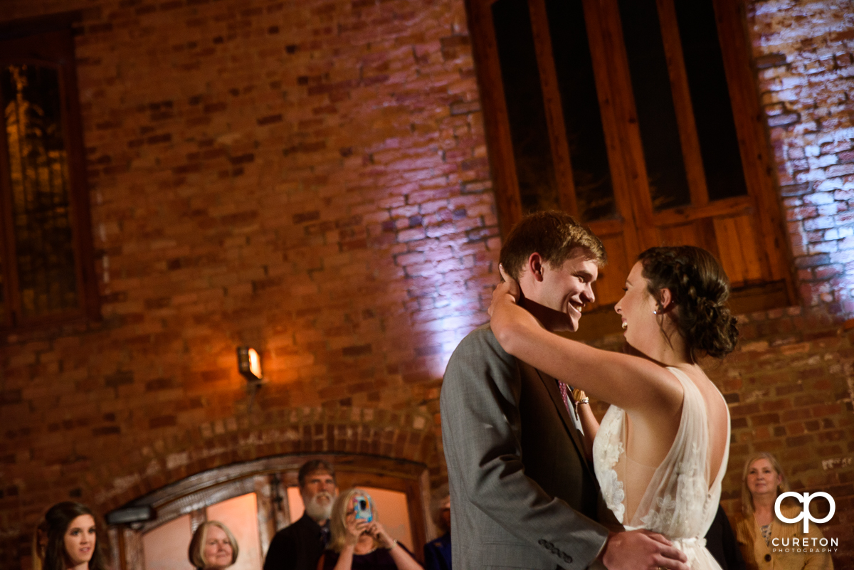 Bride and groom having a first dance at the Old Cigar Warehouse wedding reception.