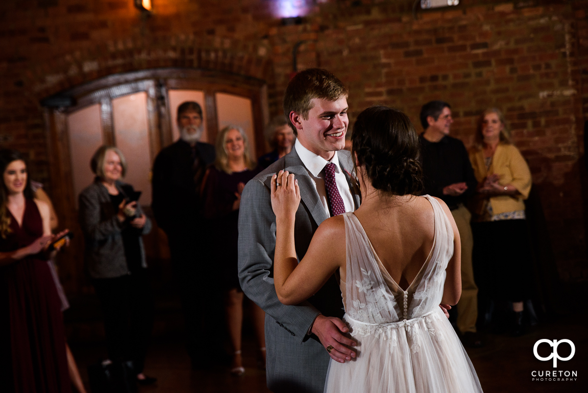 Groom smiling during the wedding reception.