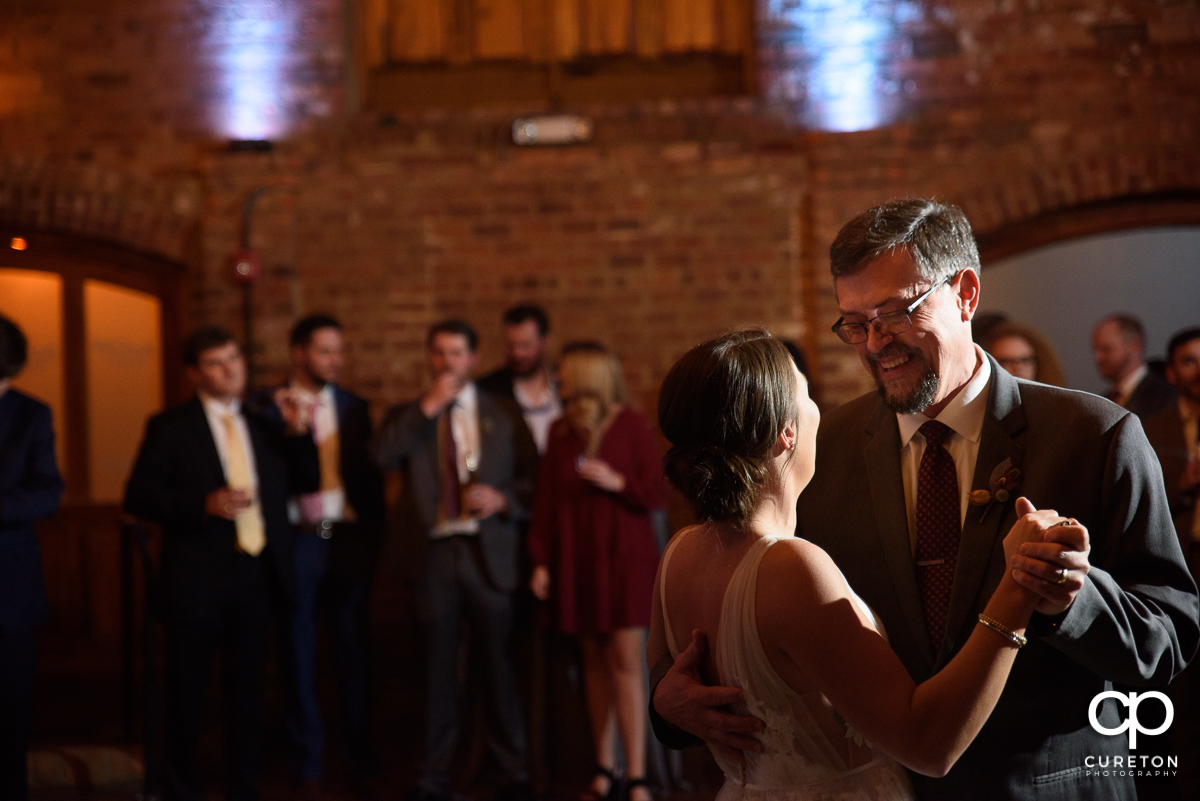 Bride dancing with her father.