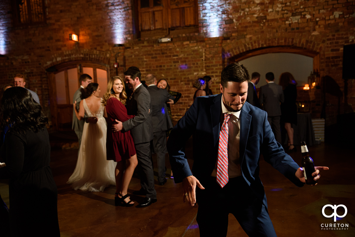 Guests dancing to the sounds of Jumping Jukebox at the Old Cigar Warehouse reception.