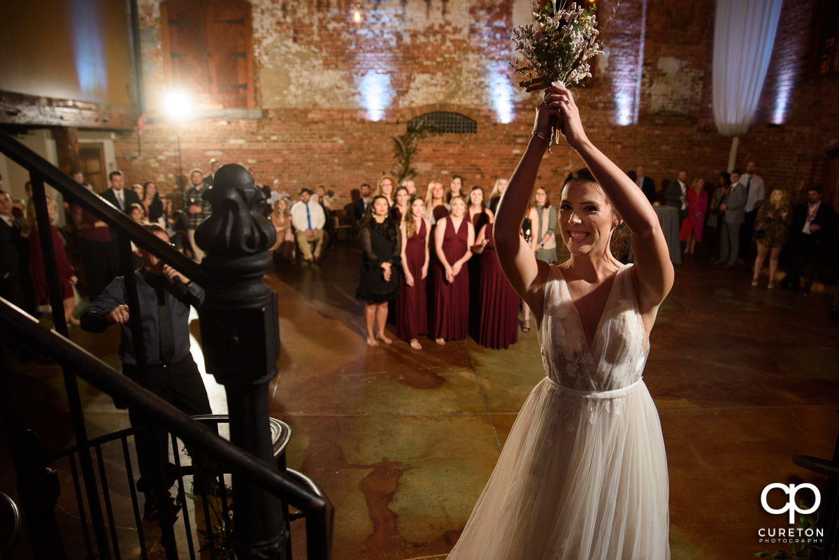 Bride tossing the bouquet.